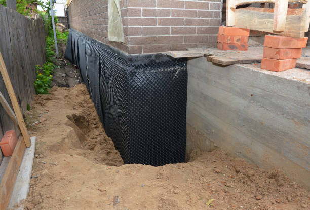 Happy homeowners after waterproofing job in Oyster Bay